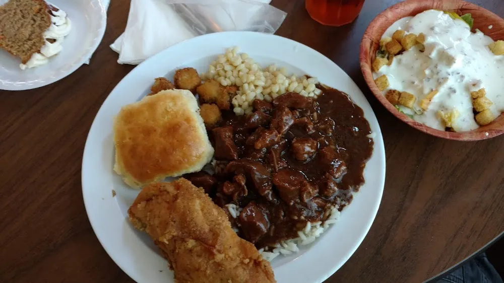 Stew Beef an Rice with Fried Chicken Fried Squash Corn an Biscuit